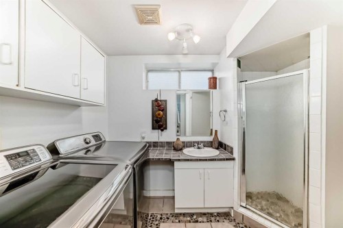 80 Hidden Point Nw, Calgary, AB - Indoor Photo Showing Laundry Room
