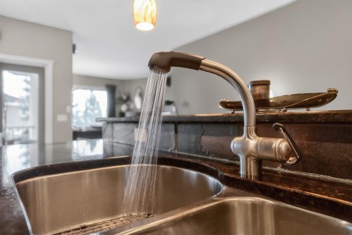 2735 Evercreek Bluffs Way Sw, Calgary, AB - Indoor Photo Showing Kitchen With Double Sink