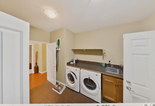 2735 Evercreek Bluffs Way Sw, Calgary, AB - Indoor Photo Showing Laundry Room