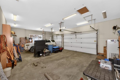 2735 Evercreek Bluffs Way Sw, Calgary, AB - Indoor Photo Showing Garage
