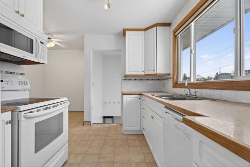 58 Westwood Drive Sw, Calgary, AB - Indoor Photo Showing Kitchen With Double Sink