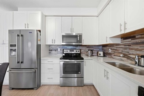 3108-99 Copperstone Park Se, Calgary, AB - Indoor Photo Showing Kitchen With Stainless Steel Kitchen With Double Sink