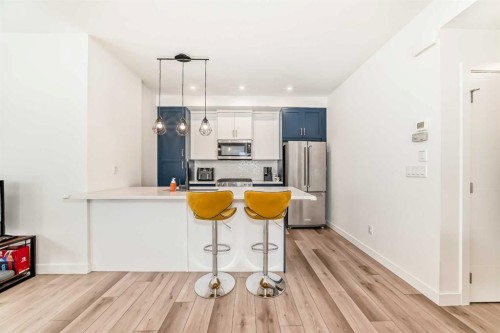 44 Spring Creek Common Sw, Calgary, AB - Indoor Photo Showing Kitchen With Stainless Steel Kitchen With Upgraded Kitchen