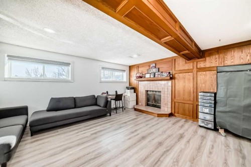 584 Whiteridge Way Ne, Calgary, AB - Indoor Photo Showing Living Room With Fireplace