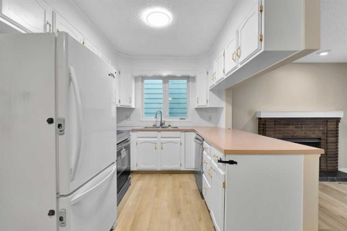 1111 Berkley Drive Nw, Calgary, AB - Indoor Photo Showing Kitchen With Double Sink