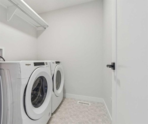 24 Willow Park Point, Cochrane, AB - Indoor Photo Showing Laundry Room