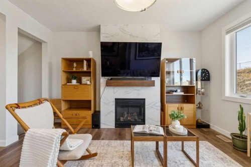 24 Willow Park Point, Cochrane, AB - Indoor Photo Showing Living Room With Fireplace