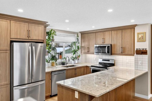 287 Masters Row Se, Calgary, AB - Indoor Photo Showing Kitchen With Double Sink With Upgraded Kitchen