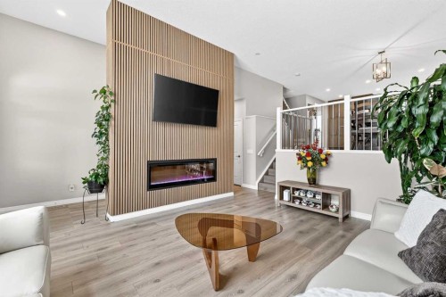 287 Masters Row Se, Calgary, AB - Indoor Photo Showing Living Room With Fireplace