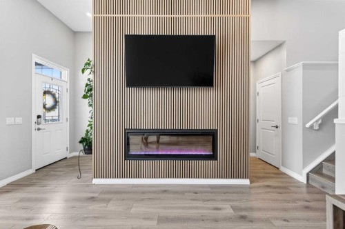 287 Masters Row Se, Calgary, AB - Indoor Photo Showing Other Room With Fireplace