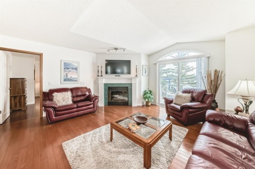 157 Hawkstone Manor Nw, Calgary, AB - Indoor Photo Showing Living Room With Fireplace