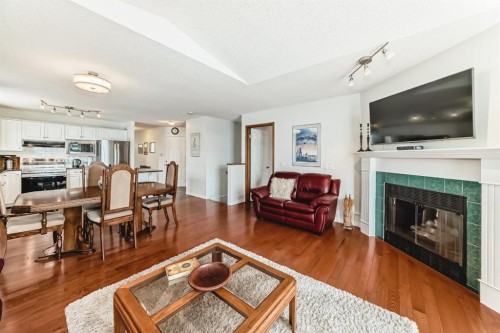 157 Hawkstone Manor Nw, Calgary, AB - Indoor Photo Showing Living Room With Fireplace