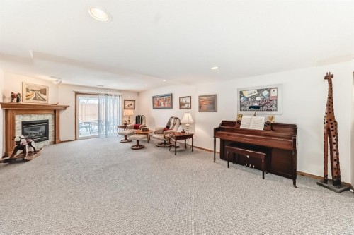 157 Hawkstone Manor Nw, Calgary, AB - Indoor With Fireplace