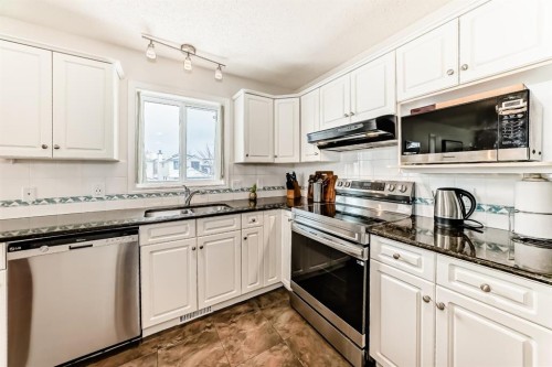 157 Hawkstone Manor Nw, Calgary, AB - Indoor Photo Showing Kitchen With Stainless Steel Kitchen With Double Sink