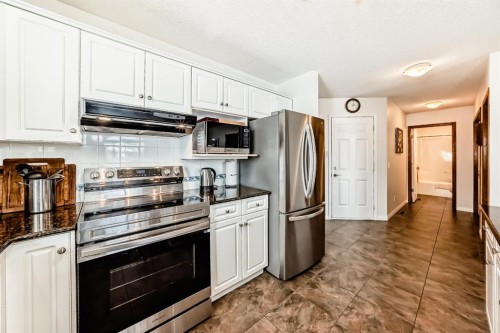157 Hawkstone Manor Nw, Calgary, AB - Indoor Photo Showing Kitchen With Stainless Steel Kitchen