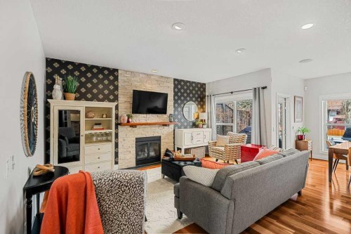 274 Somme Avenue Sw, Calgary, AB - Indoor Photo Showing Living Room With Fireplace