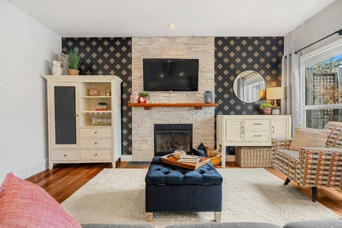 274 Somme Avenue Sw, Calgary, AB - Indoor Photo Showing Living Room With Fireplace