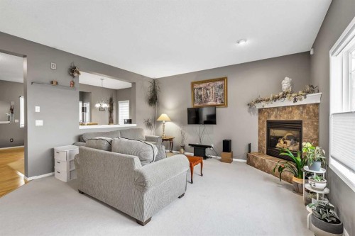 86 Evergreen Common Sw, Calgary, AB - Indoor Photo Showing Living Room With Fireplace