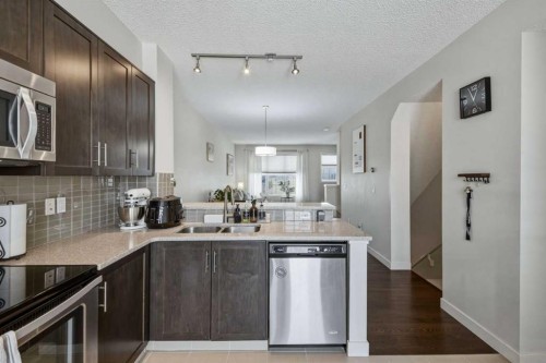 214 Nolanfield Villas Nw, Calgary, AB - Indoor Photo Showing Kitchen With Stainless Steel Kitchen With Double Sink