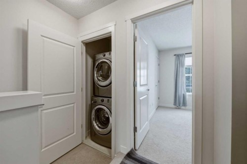214 Nolanfield Villas Nw, Calgary, AB - Indoor Photo Showing Laundry Room