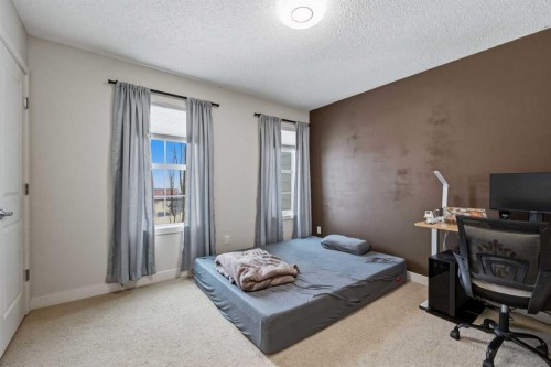 214 Nolanfield Villas Nw, Calgary, AB - Indoor Photo Showing Bedroom