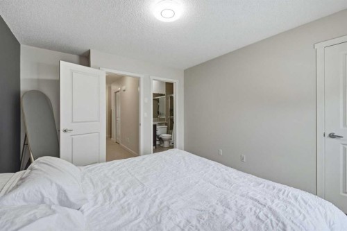 214 Nolanfield Villas Nw, Calgary, AB - Indoor Photo Showing Bedroom