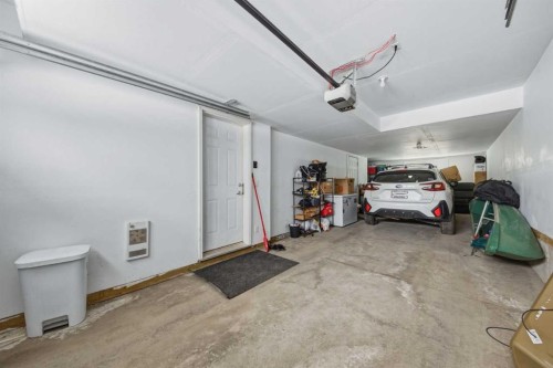 214 Nolanfield Villas Nw, Calgary, AB - Indoor Photo Showing Garage