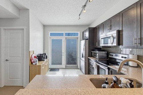 214 Nolanfield Villas Nw, Calgary, AB - Indoor Photo Showing Kitchen With Stainless Steel Kitchen
