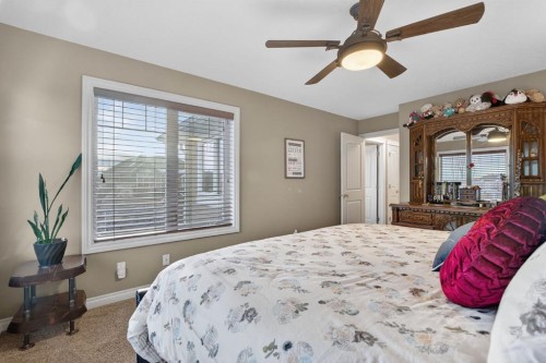 2 Ranchers Green, Okotoks, AB - Indoor Photo Showing Bedroom