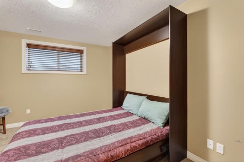 2 Ranchers Green, Okotoks, AB - Indoor Photo Showing Bedroom