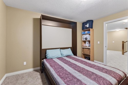 2 Ranchers Green, Okotoks, AB - Indoor Photo Showing Bedroom