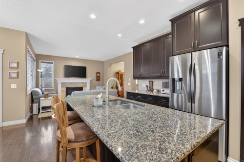 2 Ranchers Green, Okotoks, AB - Indoor Photo Showing Kitchen With Stainless Steel Kitchen With Double Sink With Upgraded Kitchen