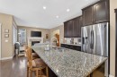 2 Ranchers Green, Okotoks, AB  - Indoor Photo Showing Kitchen With Stainless Steel Kitchen With Double Sink With Upgraded Kitchen 