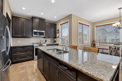 2 Ranchers Green, Okotoks, AB - Indoor Photo Showing Kitchen With Stainless Steel Kitchen With Double Sink With Upgraded Kitchen