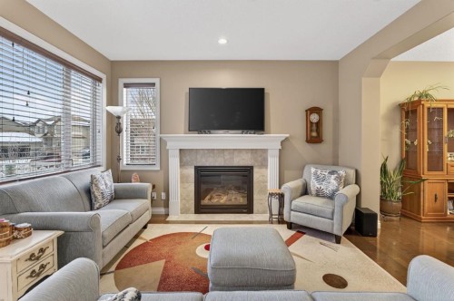 2 Ranchers Green, Okotoks, AB - Indoor Photo Showing Living Room With Fireplace