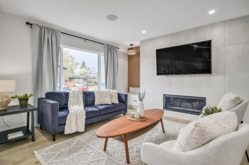 3224 24A Street Sw, Calgary, AB - Indoor Photo Showing Living Room With Fireplace