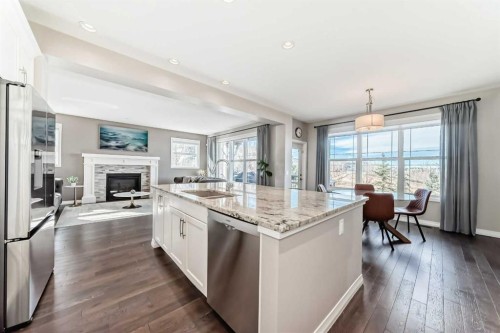 8 Masters Court Se, Calgary, AB - Indoor Photo Showing Kitchen With Fireplace With Upgraded Kitchen