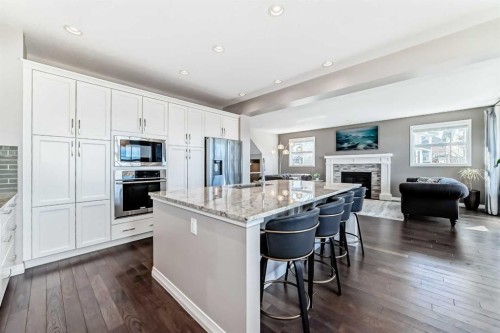8 Masters Court Se, Calgary, AB - Indoor Photo Showing Kitchen With Fireplace With Upgraded Kitchen