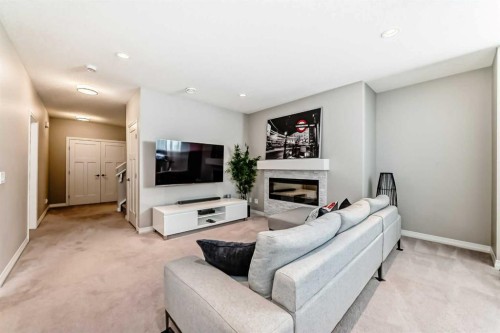 8 Masters Court Se, Calgary, AB - Indoor Photo Showing Living Room With Fireplace