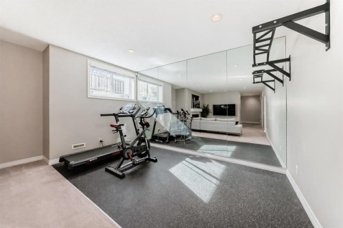 8 Masters Court Se, Calgary, AB - Indoor Photo Showing Gym Room