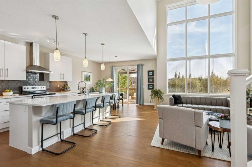 36 Sunrise Crescent, Cochrane, AB - Indoor Photo Showing Kitchen With Upgraded Kitchen