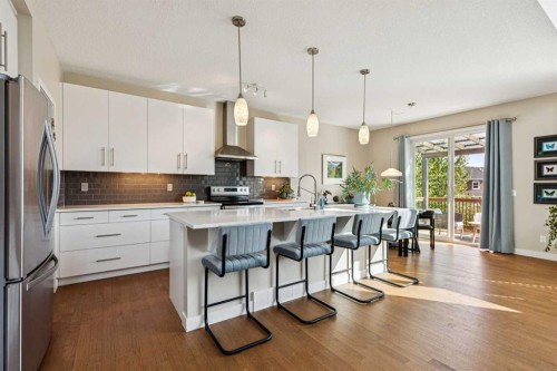 36 Sunrise Crescent, Cochrane, AB - Indoor Photo Showing Kitchen With Stainless Steel Kitchen With Upgraded Kitchen