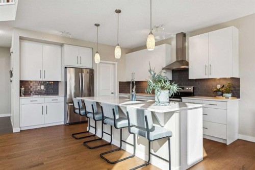 36 Sunrise Crescent, Cochrane, AB - Indoor Photo Showing Kitchen With Stainless Steel Kitchen With Upgraded Kitchen