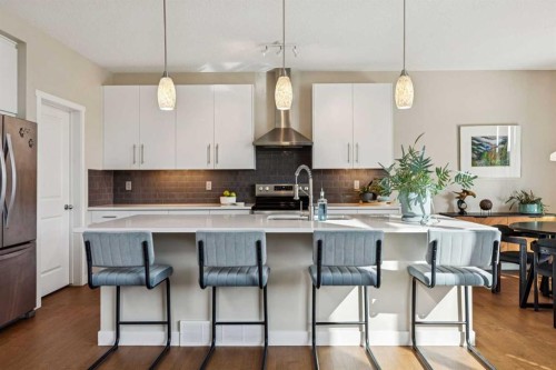 36 Sunrise Crescent, Cochrane, AB - Indoor Photo Showing Kitchen With Upgraded Kitchen