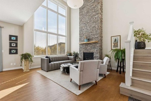 36 Sunrise Crescent, Cochrane, AB - Indoor Photo Showing Other Room With Fireplace