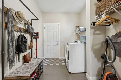 36 Sunrise Crescent, Cochrane, AB - Indoor Photo Showing Laundry Room