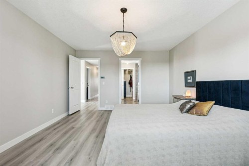 36 Sunrise Crescent, Cochrane, AB - Indoor Photo Showing Bedroom