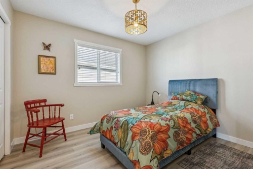 36 Sunrise Crescent, Cochrane, AB - Indoor Photo Showing Bedroom