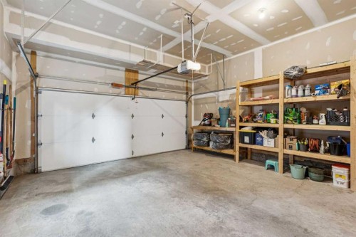 36 Sunrise Crescent, Cochrane, AB - Indoor Photo Showing Garage