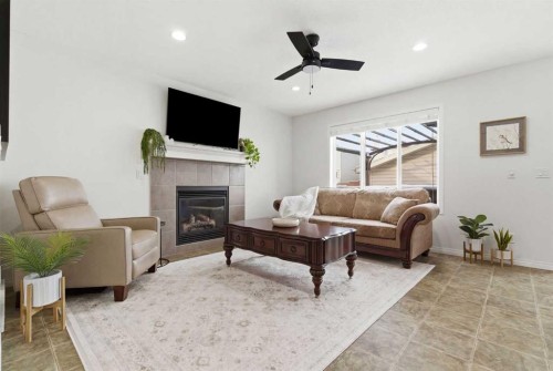 107 Cimarron Grove Circle, Okotoks, AB - Indoor Photo Showing Living Room With Fireplace